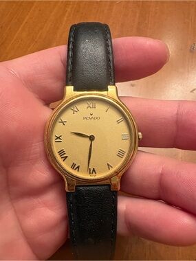 Movado Gold Dial Watch with Black Leather Strap